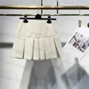 Luksusowy projektantka damska dwuczęściowa sukienka spódnica wiosna/lato nowy francuski minimalistyczny styl stały kolor piersi kamizelka w dekolcie plisowana z wysokim talią krótką spódnicę