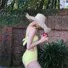 Dames badkleding één stuk zwempak vrouwen 2024 bodysuit massief geel push -up monokini sexy holle out strandkleding badpak vrouw