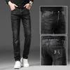 Jeans europeus de luxo de luxo masculino masculino Slim Fit Small reta Trend Trend Autumn e Winter Elastic Casual Long Pants Longo de espessura estilo