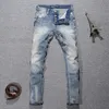 Włoski styl mody dżinsy retro jasnoniebieski elastyczny szczupły dopasowanie podarte przyciski spodnie Vintage Designer Denim Pants 240420