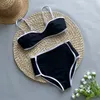 Bikinis de maillots de bain pour femmes Set 2024 Fashion Black White Patchwork Addage rembourré et string Swimsuits Sexy Female Bathing Fissure brésilienne