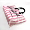 Saint Barth märke Fashion Pink Vertical Striped Canvas Handväskor Kvinnor Tassel Design av hög kvalitet Casual Tote Beach Shoulder Bag 240429