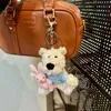 Nyckelringar Lanyards Söt vit valp Plush Keychain Cartoon Puppy Doll Nyckelring för väskan Pendant Creative Fur Puppy Filling Keychain för gåvor Q240429