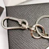 Moda Tasarımcı Kolye Keychain Lüks Erkek Kadın Sevenler Anahtarlar Mektuplar Araba Çantası Unisex Anahtar Zincirleri Çok Yönlü Anahtarlık Hediyeler Aksesuarlar