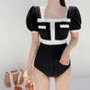 Swimwear femminile 2024 High Waist Hollo Hollow Monokini Swimsuit da bagno monopezzo femmina Corea Sonta corta BAME Abito da bagno Bianco