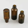 Bouteilles de rangement 500pcs / lot en verre ambre liquide d'huile essentielle d'huile de voyage rechargeable bouteille marron flacon cosmétique 5-100 ml