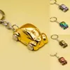 Keychains Lanyards 2023 Metall Autoformschlüsselringe farbenfrohe Autoschlüsselkeychain -Mode -Simulation Kleinwagen Schlüsselbund Geschenk für Autoliebhaber Anhänger Q240429