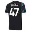 24/25 Ev Futbol Jersey de Bruyne Haaland Mans Şehirler Sterling Mahrez Foden De Bruyne Fan Oyuncu Sürüm 2023 2024 Futbol Üstleri Gömlek Çocuk Kiti Setleri Ekipmanları