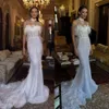 Ogstuff Dresses Mermaid Strapless Designer Feathers Crystal Wedding Dress Sweep Train Backless 웨딩 신부 가운