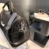 Mulher Men Men Bolsa Duffel Bag Crossbody Saco de viagem de grande capacidade Bolsas de bagagem de designer de nylon