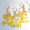 Anahtarlıklar zarif papatya 26 harfli tatlı emaye çiçek arısı alfabe anahtarlamaları adı ilk araba anahtar zincirleri çanta kolye süslemeleri