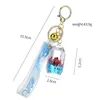 Keychains lanyards meisjes hartvormige acryl drijvende sleutelhanger oceaan poppen deksel en sleutelhanger hangerolie vloeistof hanger Keychain Q240429