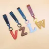 Keychains Lanyards Hot Selling Letters Leather Keychain Bags Telefonfodral Keychain Brackets Friends Familj Lovers Keychains Car Bagage Pendants Gifts Q240429