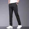 Calça masculina roupas novas para a primavera e verão Novo tecido elástico fino de lyocell calças casuais calças de cintura Ultra-Thin Business Q240429