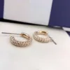 Arete Swarovski Diseñador Mujeres Calidad original de moda Luxury Fashion Minimalist Full Diamond Half Ring Hebilla Fresh y encantador anillo redondo Pendientes perforados
