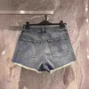 Kvinnors shorts designer märke 24 vår/sommar nyålder reducerar temperament mångsidig hög midjepanel läder gammal blommor pälskant design tvättad denim y52h