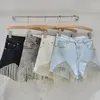 Kvinnors shorts Tassel Chain Denim Summer 2024 Hög midja bantning Sexig europeisk och amerikansk stil tung industri