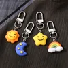 Süßer Regenbogen Sonnenstar Mond Gesicht Tastatur Karton Kawaii Keyring für Frauen Männer Kinder Freund Tasche Auto Airpods Box Telefon Charme Schmuck Schmuck