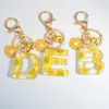Keychains Exquisite Daisy 26 Letter Sweet Email Bloem Bee Alfabet Keyrings Naam Initiële auto Key Chains Bag Hanger -ornamenten