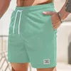 Mäns shorts män beskurna byxor sommaren corduroy med elastisk dragkamp i midjan fickor solid färg rak bredben streetwear