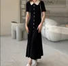 2024 Autumn New Sandro French Hook Flower Hollow Spets Collar Bubble Sleeve Dress Single Row Gold Button Sticked Long Dress for Women