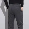Męskie dżinsy zimowe nowe męskie polarowe szczotkowane spodnie zagęszczone ciepłe, szczupłe elastyczne talia czarne spodnie biznesowe marka ubrań