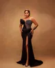 2024 Black Mermaid Prom Dresses Sexy Crystal Sequined Prom Gowns One Shoulder Long Sleeves Sheer Side Split Formal Evening Dress Hollow Back