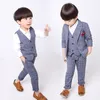 Teenage Children's Clothing Boys Korean Suit Children Plaid Pak Waistcoat Jurk vierkoppige set (jas + vest + shirt + broek) en een cadeau-vlinderdas