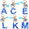 Keychains Crystal A-Z Initials Key Chain avec une lettre de résine papillon