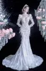 Plus taille luxueuse robes de mariée en dentelle en dentelle arabe aso ebi manches longues cristaux perles sirène perlée robes nuptiales