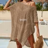 Strandklänning kvinnor 2024 sommar sundress sexig ihålig textur lös pullover bikini sunblock fasta polyester tunika utflykter täcker