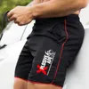 Shorts masculins Été Nouvelle tendance décontractée cordon de crampons pour hommes shorts sportifs minces mince séchage rapide et décontracté ruisseonnette à cinq quarts pantalons J240429