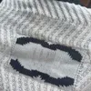 デザイナーの女性用Tシャツキャミソールベスト編み編みセーターのための女性の薄い夏のデザインは、内側と外側の両方の袖なしトップを備えています