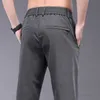 Calça masculina roupas novas para a primavera e verão Novo tecido elástico fino de lyocell calças casuais calças de cintura Ultra-Thin Business Q240429