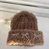 Basker koreansk version ins bow plysch hatt kvinnors höst och vinter förtjockad varma mjuka stickade söta skalle beanie hattar