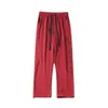 Nova calça estampada vermelha de estilo chinês para homens na primavera 2024, novas calças casuais da moda e solta
