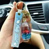 Keychains lanyards meisjes hartvormige acryl drijvende sleutelhanger oceaan poppen deksel en sleutelhanger hangerolie vloeistof hanger Keychain Q240429