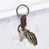 Schlüsselanhänger Vintage gewebte Legierung Handknochen Cowide Schlüsselbundwagen kreatives einfaches Geschenk