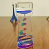 Тайкер -часы двойной цвет масла жидкость плавучих пузырьков на стол.
