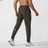 Pantaloni maschili ll uomini abbigliamento da design yoga sport sport rapido dring palestra tasche per pantaloni per pantaloni per pantaloni per la vita elastica casual 1ihk per w dhet1