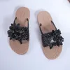 Tofflor kvinnors mode blommor dekor flätade flip flops Summer Clip Toe Flat Sandals Casual Vacation Non-Slip Beach Slides