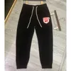 Calças esportivas casuais masculinas grampo de grampo bordado assinatura técnica algodão jogpants macio masculino oversized cordão cinto calças pista homem calça