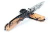 BRX50 Couteau pliant assisté Flipper 440C 3D Titanium Coated Drop Point Blade Wood avec poignée en tôle d'acier Couteaux de poche EDC Outils