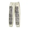 Erkekler Pantolon 24SS Tasarımcı Sonbahar/Kış Yeni Yıpranmış ve Hasarlı Vintage Style Erkek ve Kadın Gevşek Boş Zamanlı Spor Kravat Ayakları Guard Pants Modeli