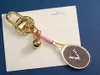 تصميم مفاتيح مصمم للرجال للنساء أزياء التنس مضرب السيارات الفاخرة مفاتيح مفاتيح الفولاذ المقاوم للصدأ الأكياس سلسلة الأكياس قلادة الحب هدية