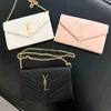 Äkta läder quiltade kuvertväska woc designer väska luxurys handväska kaviar totes kedja axel crossbody väskor kvinnor mens messenger lady clutch svart jämn väska