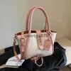 Sacs à bandoulière Le petit sac populaire de cette année pour les femmes au printemps est polyvalent.Sac à bandoulière à bandoulière unique de couleur contrastée, seau portable, nouvelle collection 2024, H2422