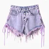 Kvinnors shorts hög midja tvättade burrs mini jeans kvinnor båda sidor lila kort gata sexig mode tassel denim