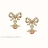 Designer Bijoux de luxe VivienenWestwoods Satellite Viviane Westwood Empress Dowager Western Purple Bowknot Stéréo Planète Boucles d'oreilles Femme Or Plein Diamant Zir