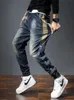 Jeans da uomo Pantaloni Harem Tasche moda Desinger Vestibilità ampia Jeans larghi da moto Uomo Stretch Retro Streetwear Jeans affusolati rilassati 240124